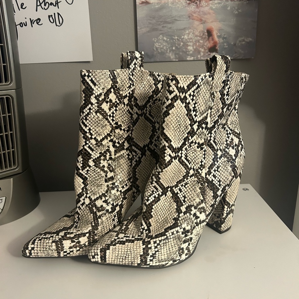 Snake skin heeled boots